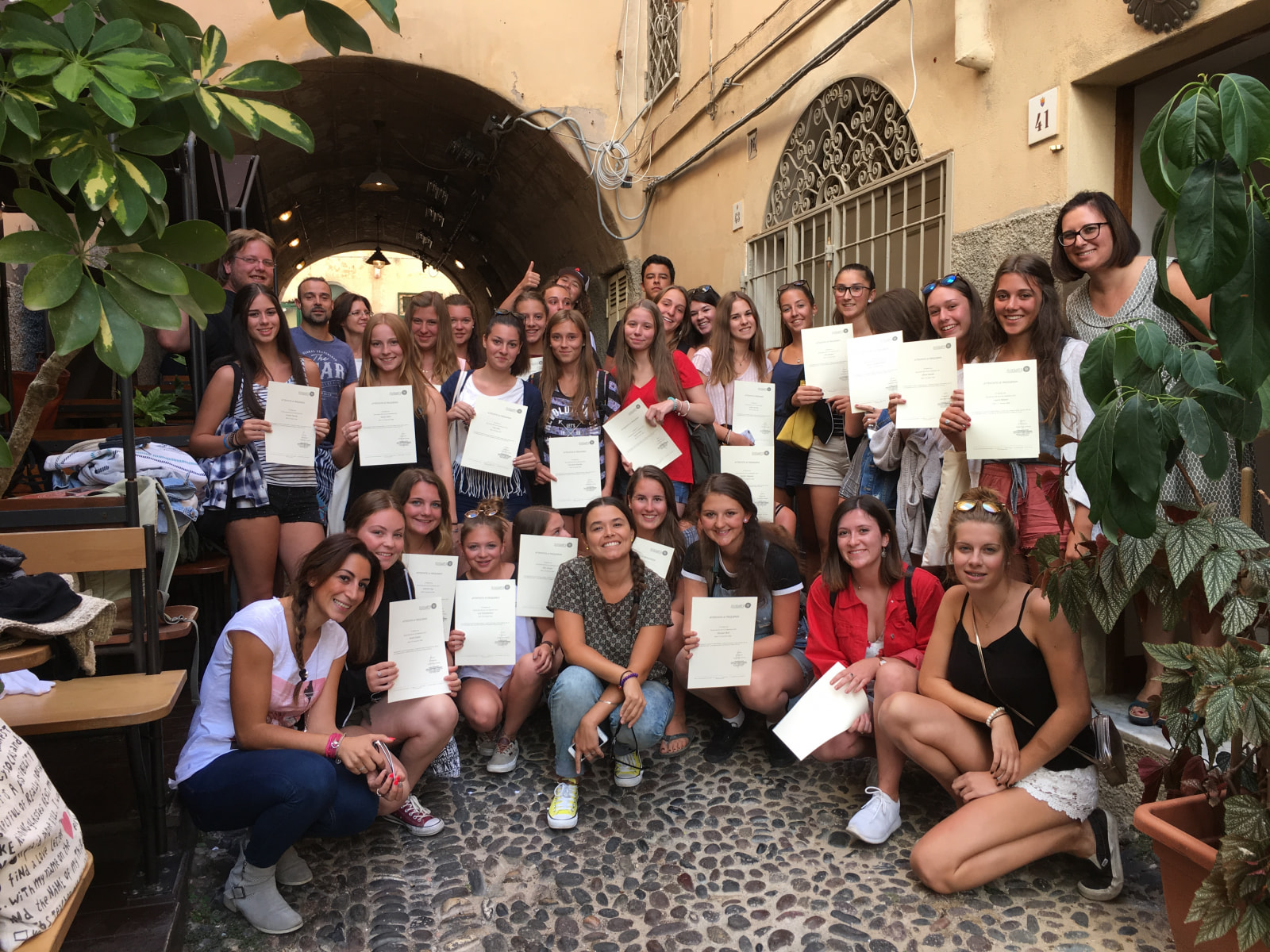 School group Italian language learners on last day of Italian course in front of Pintadera school Alghero