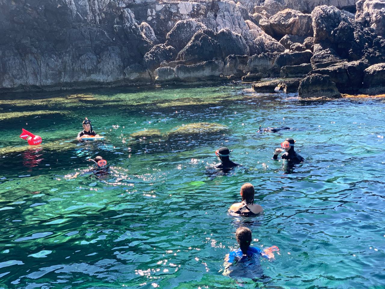 Teens snorkeling in the Porto Conte Park